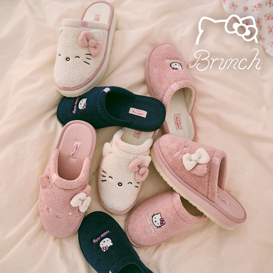 Set of Hello Kitty slippers on a soft surface with 'Brunch' brand logo.