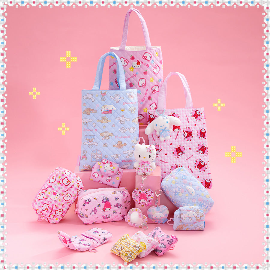 Sanrio Characters all-over print on pastel-colored bags and accessories on a pink background. 