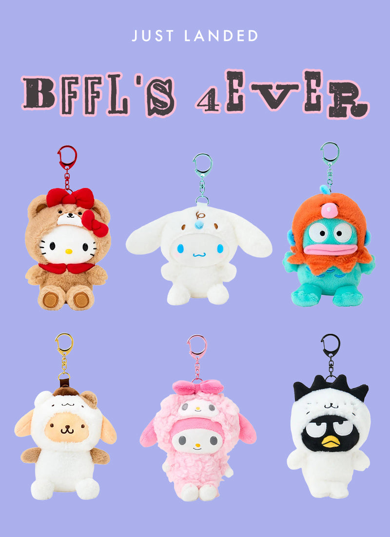 Six plush character keychains arranged in a 2x3 grid on a light lavender background, with stylized text at the top reading 'JUST LANDED' and 'BFFL'S 4 EVER'. The characters include Hello Kitty in a teddy bear outfit, a white bunny with blue eyes, a teal creature with orange hair, a cream sheep, a pink character in a pink outfit, and a white creature with a black-and-white face.