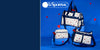 Three LeSportsac duffel and shoulder bags with a white base and red floral print, displayed on a blue background with floating red hearts.