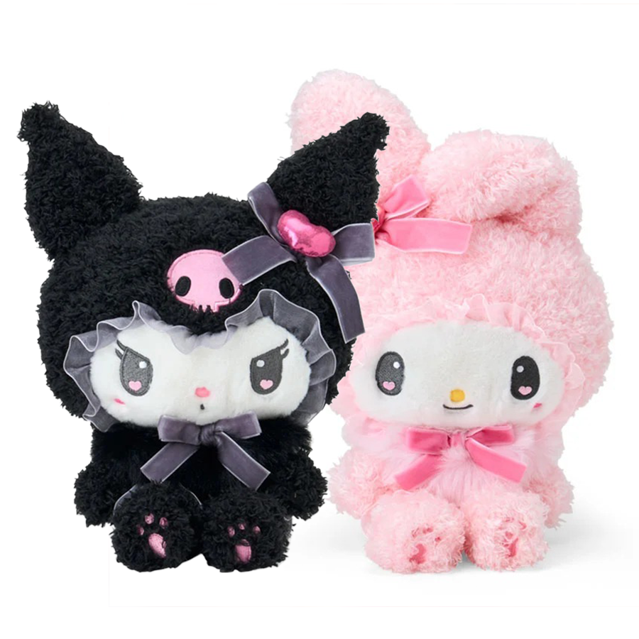Two plush toys, one black and one pink, with cute faces and bows on a white background.