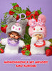 Two plush character keychains styled with strawberries on a purple background. 