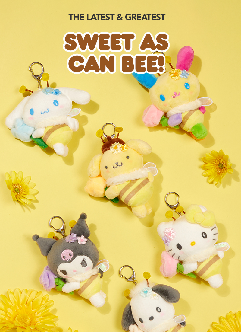 Six Sanrio character plush keychains arranged on a yellow background with daisy flowers and large text reading 'THE LATEST & GREATEST SWEET AS CAN BEE!'. 