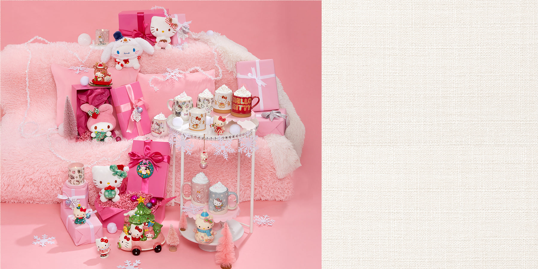 Pink-themed decorative set with toys and gift boxes on a pink background