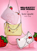 Collaboration between Hello Kitty and Friends and Kate Spade New York on handbags with strawberry designs on a pink background.