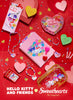 Hello Kitty and Friends x Sweethearts Candies Artwork | Product laid out against a red background with heart-shaped candy. 